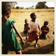 Girls play an afternoon dancing game in a village an hour outside Kabwe, Zambia. Many of the people here are subsistence farmers who grow tomatoes, cabbage, kale, and other food.
